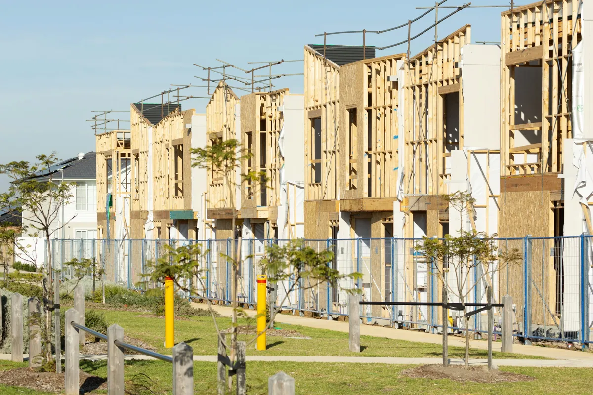 Spread-out low-rise residential construction showing repeated wood-framed units